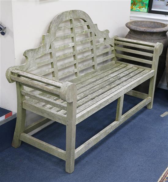 A pair of Lutyens style teak garden benches, L 168cm x W.166cm